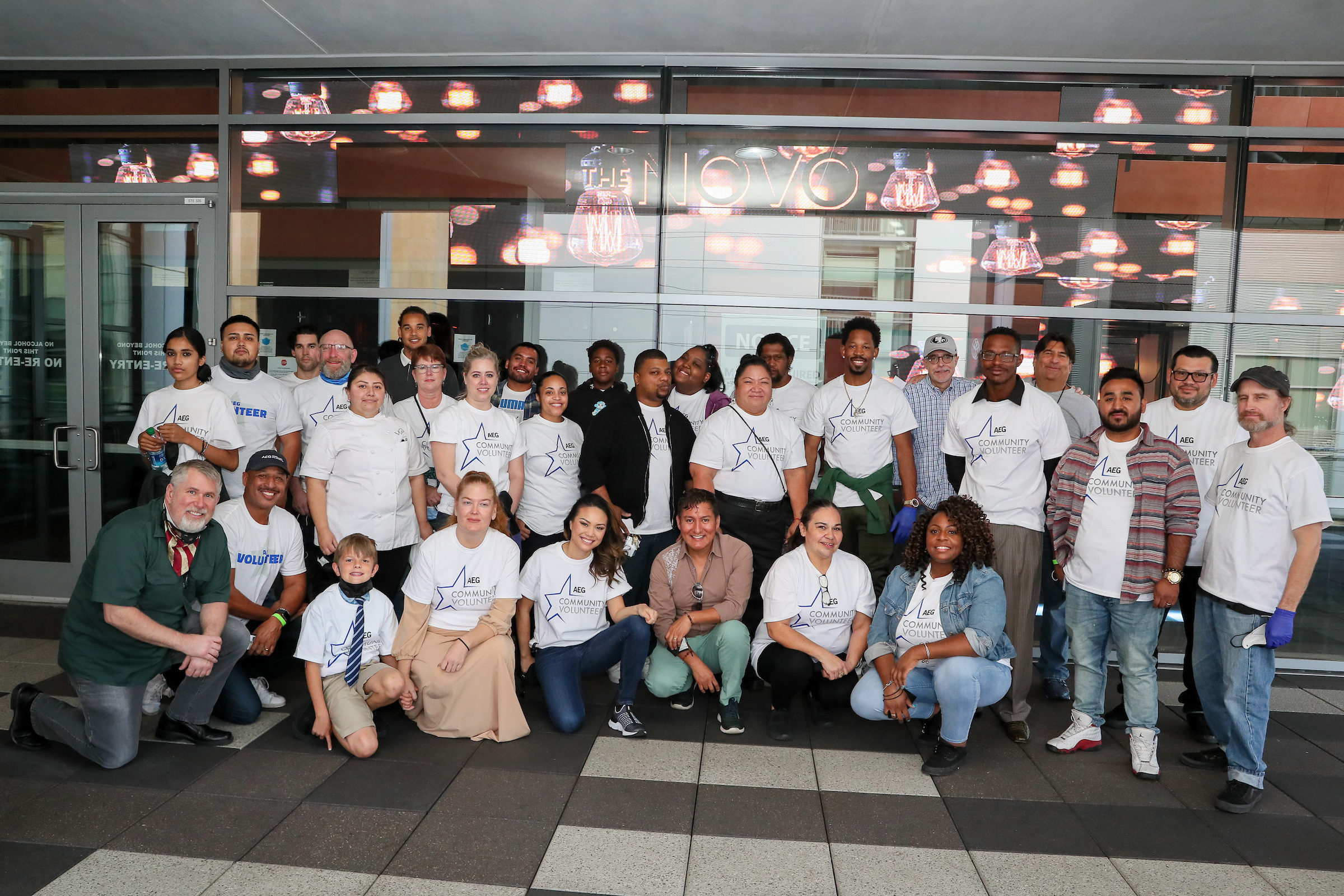 AEG employee volunteers take a group photo after feeding veterans on Thanksgiving