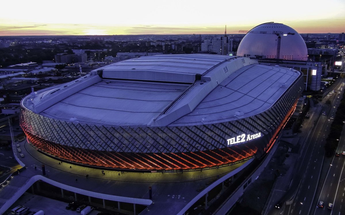 Overhead image of the Tele2 Arena at dusk with the lights on