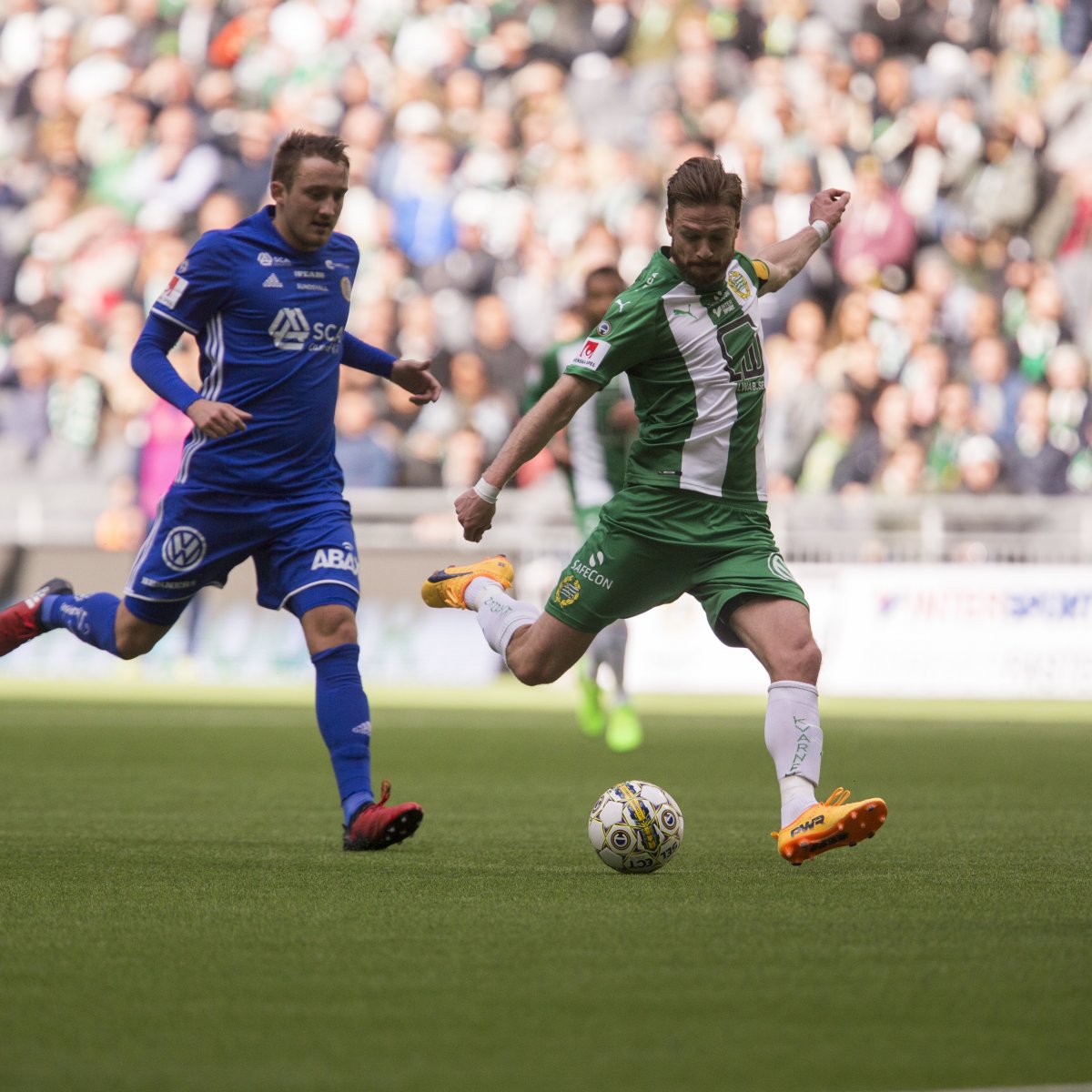 Hammarby soccer player about to kick the ball