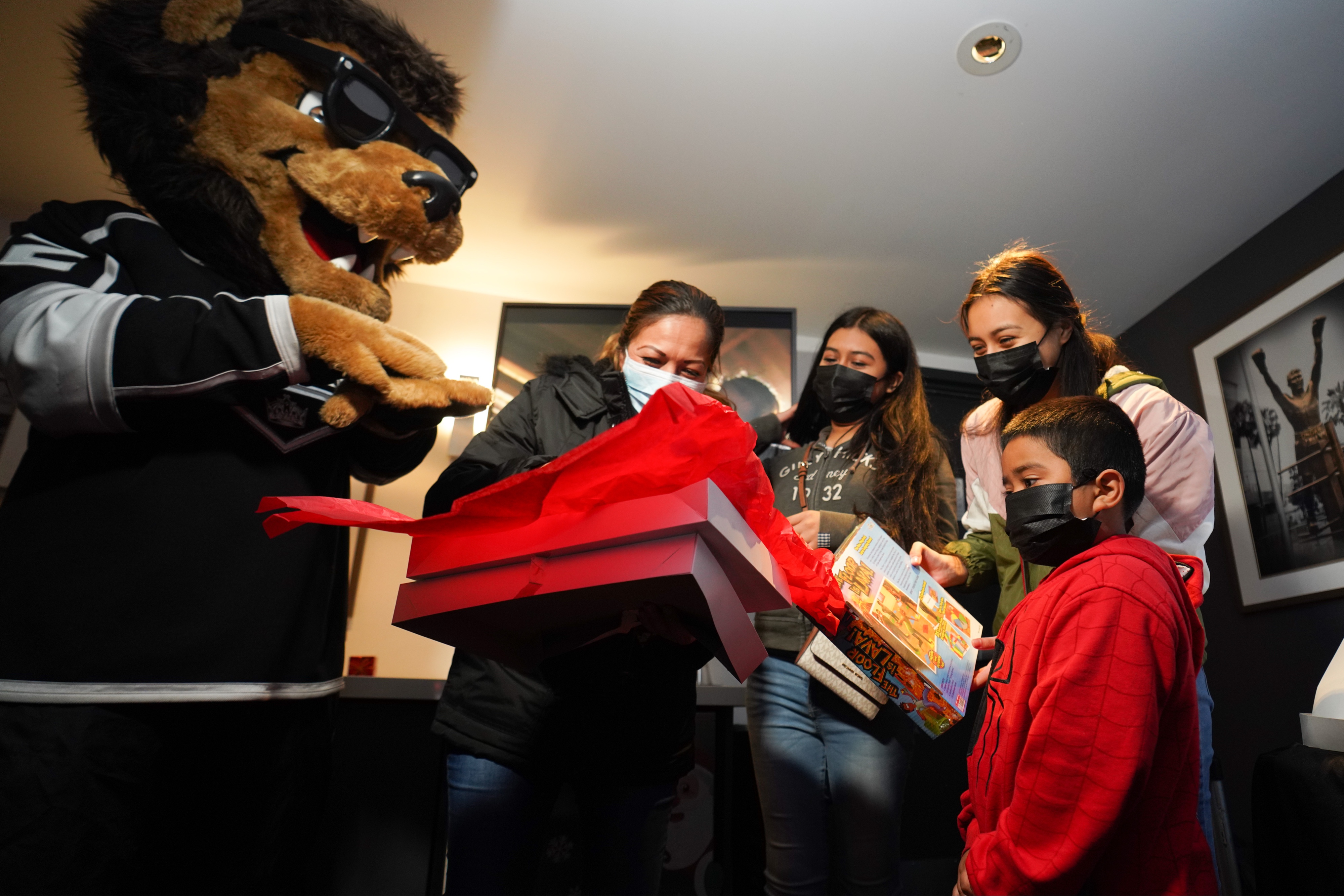 LA Kings mascot Bailey helps families open presents