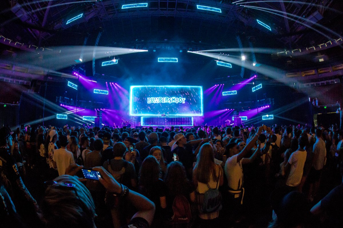 Image of the stage from the crowd that reads "Bumbershoot" over a DJ