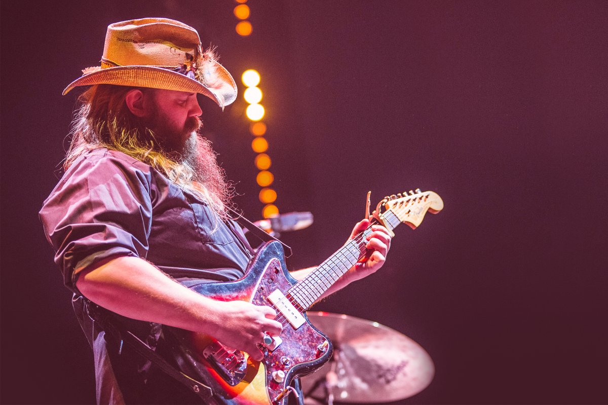 Close up image of Chris Stapleton playing the guitar at Country to Country
