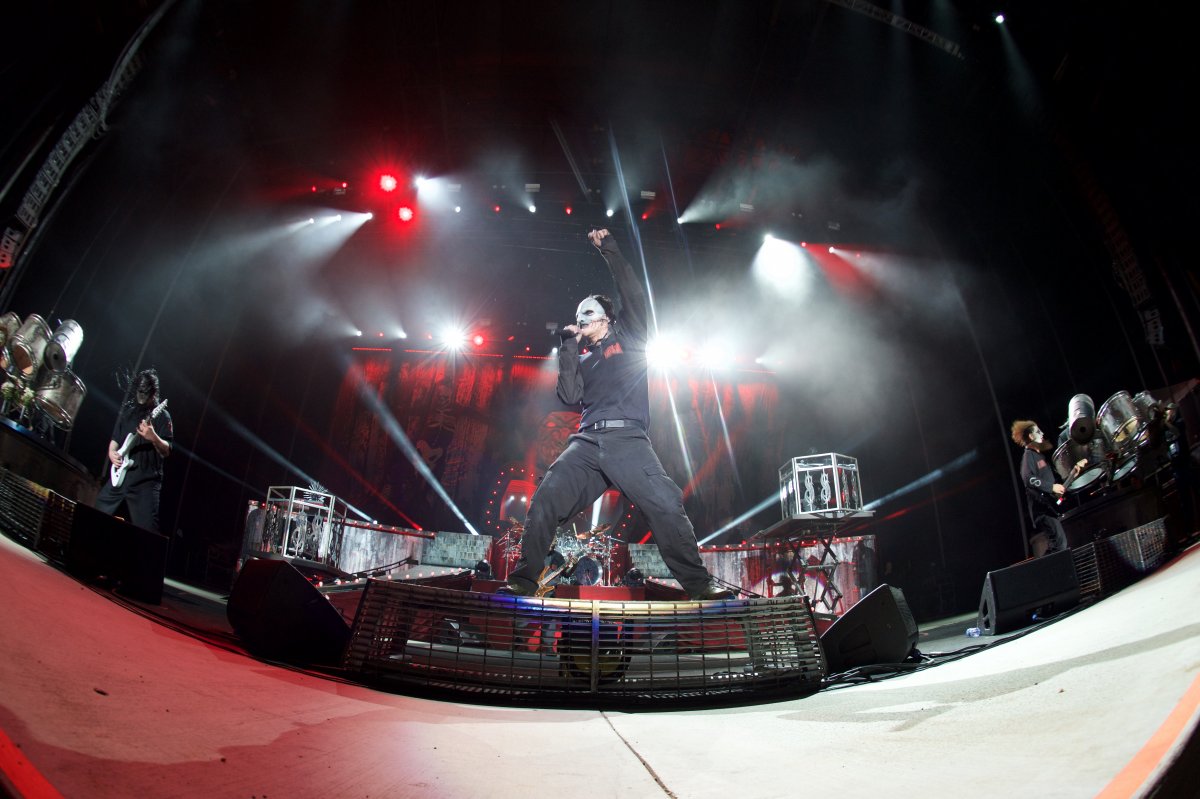 Image looking up at a performer singing on stage