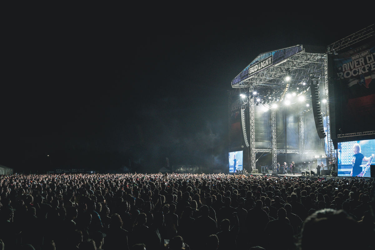 Image from the side of performers on stage at night