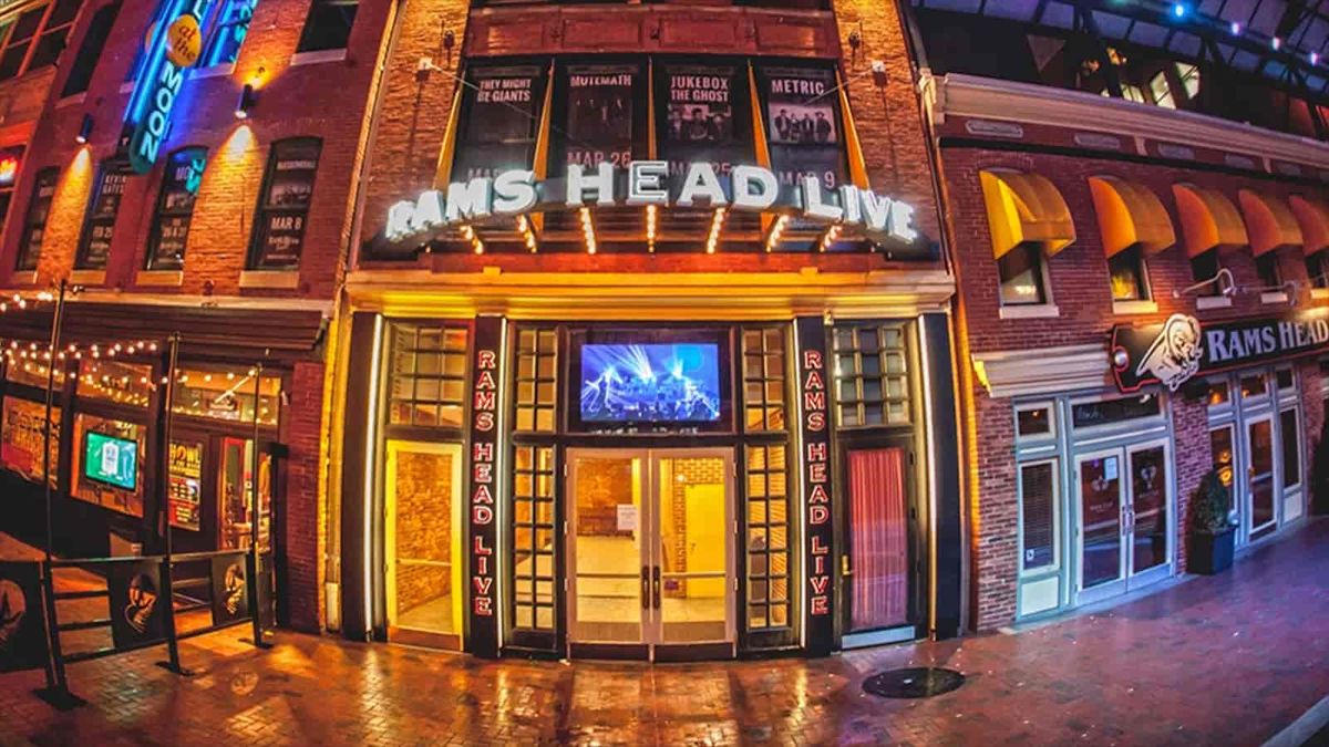 Interior image of Rams Head Live! behind the DJ booth during a concert looking on stage