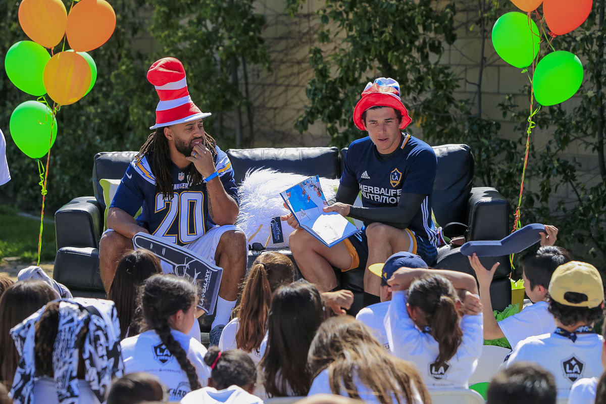 LA Galaxy goalie Brian Rowe and LA Chargers safety Dwight Lowery read to students during Read Across America Day at StubHub Center.