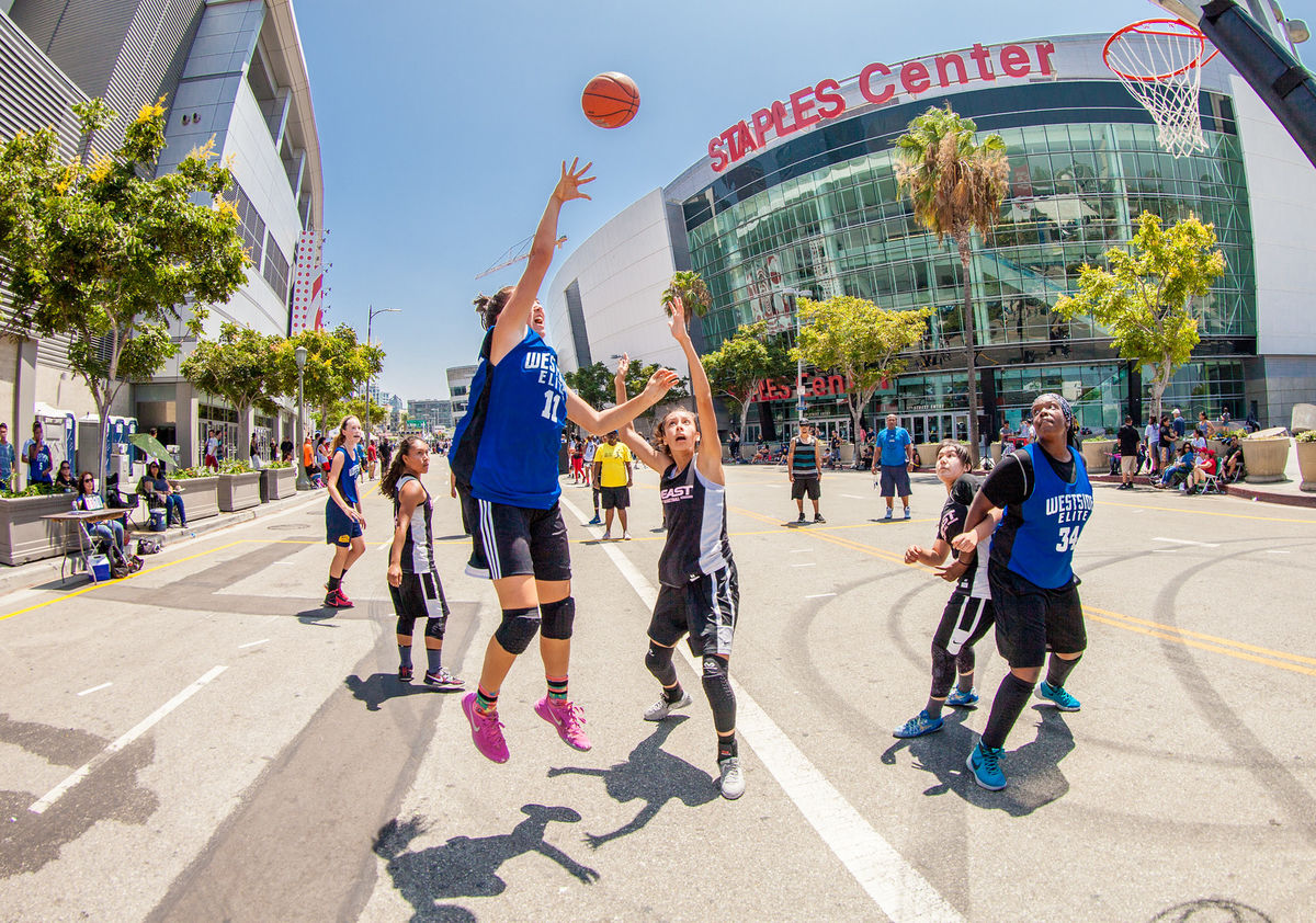 Three-on-three basketball teams compete on courts in front of STAPLES Center in downtown Los Angeles during the Nike Basketball 3ON3 Tournament presented by 24 Hour Fitness at L.A. LIVE.