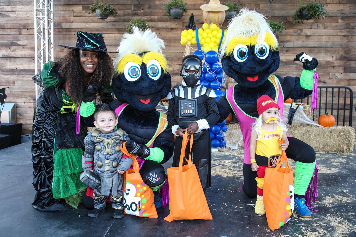 Costumed guests pose with two LA Galaxy mascots during the 11th annual Treats-n-Suites Halloween Bash at StubHub Center in Carson, Calif. on October 20, 2017.