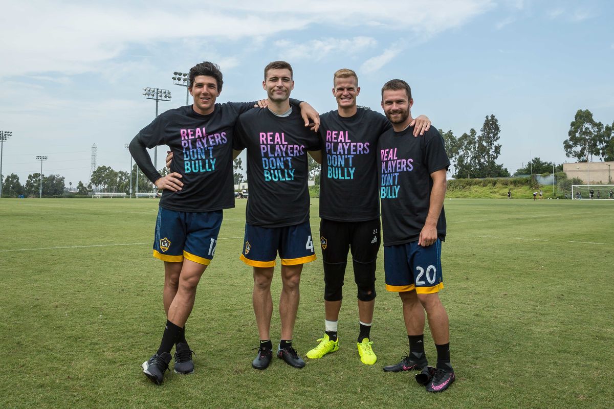 LA Galaxy players Brian Rowe, Dave Romney, Jon Kempin and Jack McInerney participate in the Playworks campaign, Real Players Don’t Bully, by wearing shirts with the campaign slogan to raise awareness about National Bullying Prevention Month.