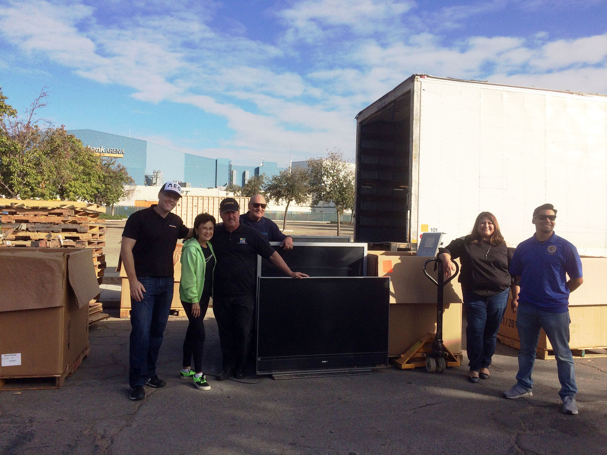 AEG’s Rabobank Arena employees and Bakersfield Mayor Karen Goh (second from left) load recycled e-waste items into trucks at the 5th Annual Bakersfield Recycles Day on November 4, 2017.