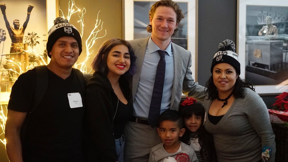 LA Kings forward Tyler Toffoli welcomes families and poses for pictures at the LA Kings Adopt-A-Family event at STAPLES Center on December 9, 2017.