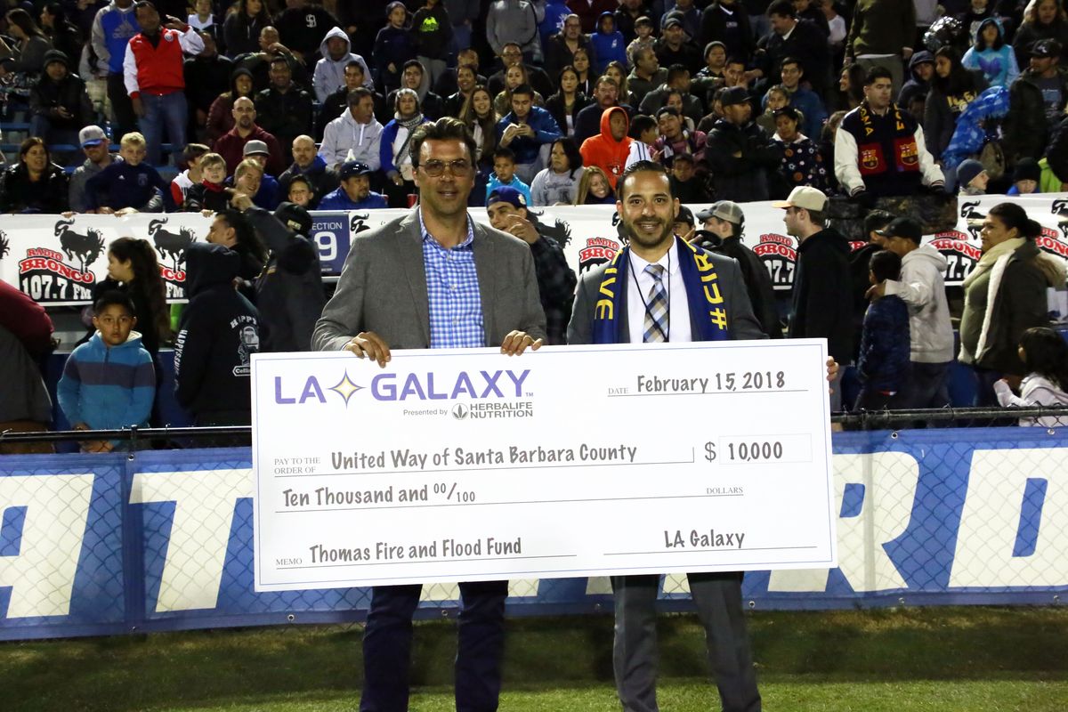 LA Galaxy Technical Director Jovan Kirovski presents a check to United Way Santa Barbara in support of the Thomas Fire & Flood Fund.