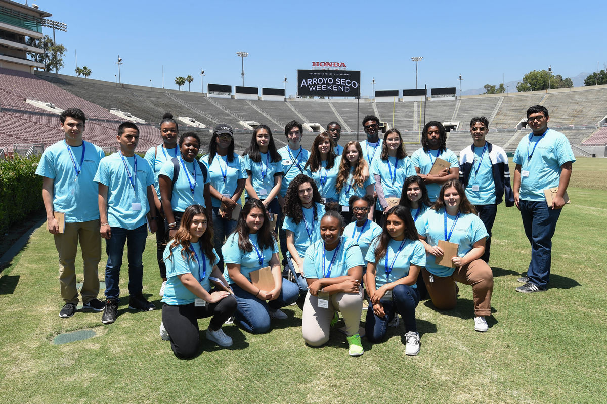 Students gather on the field at the Rose Bowl for a group photo during the Arroyo Seco Weekend Youth Program. 
