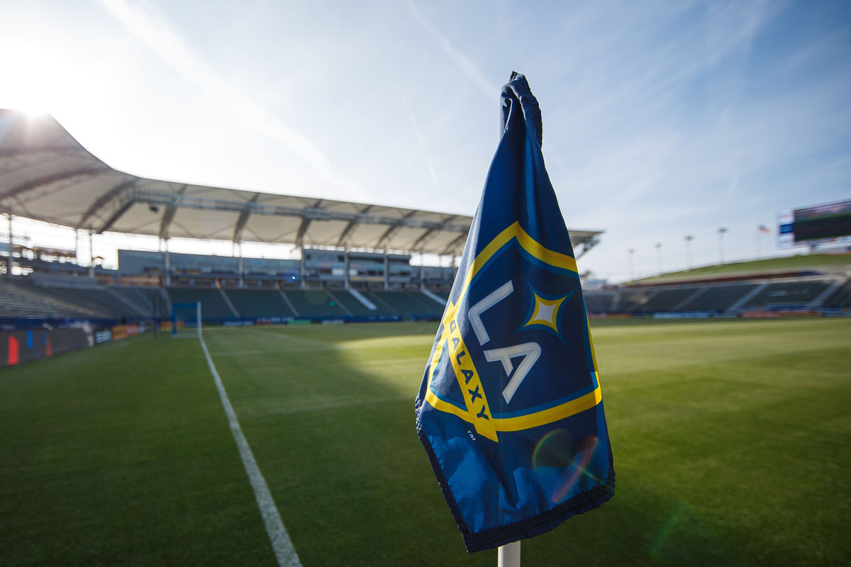 An LA Galaxy flag hangs from the field corner marker in an empty pitch at StubhHub Center. 