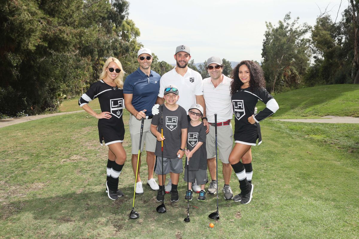 LA Kings defenseman Alec Martinez and members of the LA Kings Ice Crew greet guests on the golf course at the LA Kings Golf Tournament on October 1, 2018. 