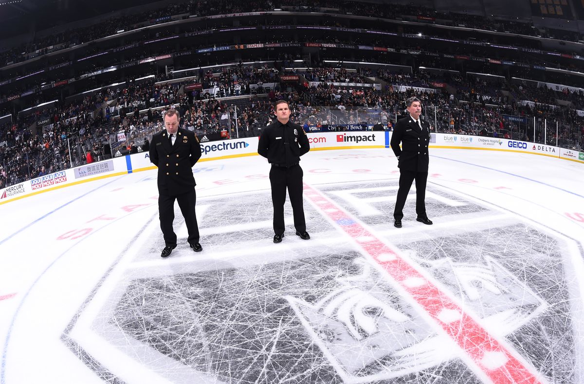 Chief Deputy Fred Mathis – the Commander of LA City Fire Department’s Administrative Operations Bureau, Firefighter/Paramedic Michael Mandahl – Medal of Valor Recipient and LA City Fire Department Captain Ted Kalnas are honored on the ice at STAPLES Center during the LA Kings game on Nov. 25, 2018. 