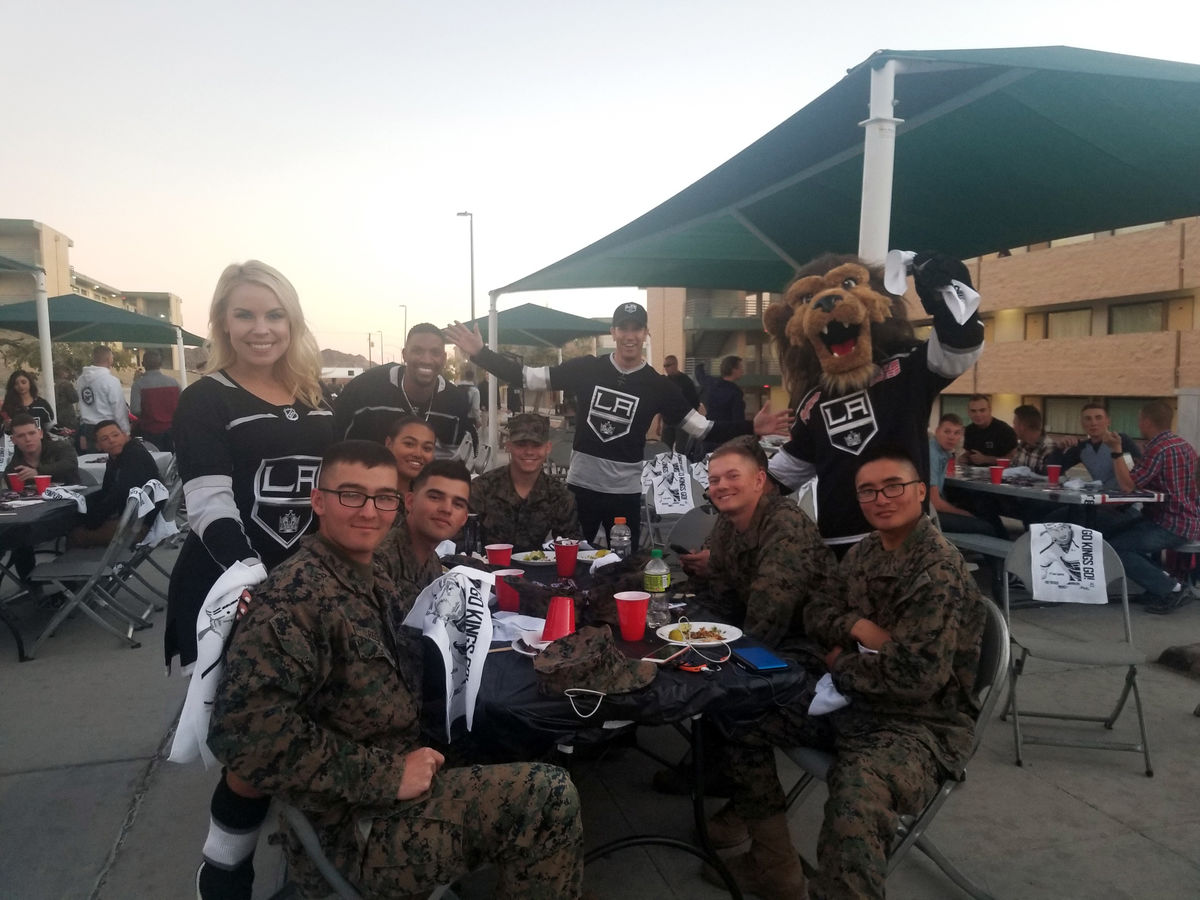 LA Kings Ice Crew and Kings mascot Bailey join marines for dinner as part of the LA Kings Watch Party at Twentynine Palms Marine Corps Air Ground Combat Center.