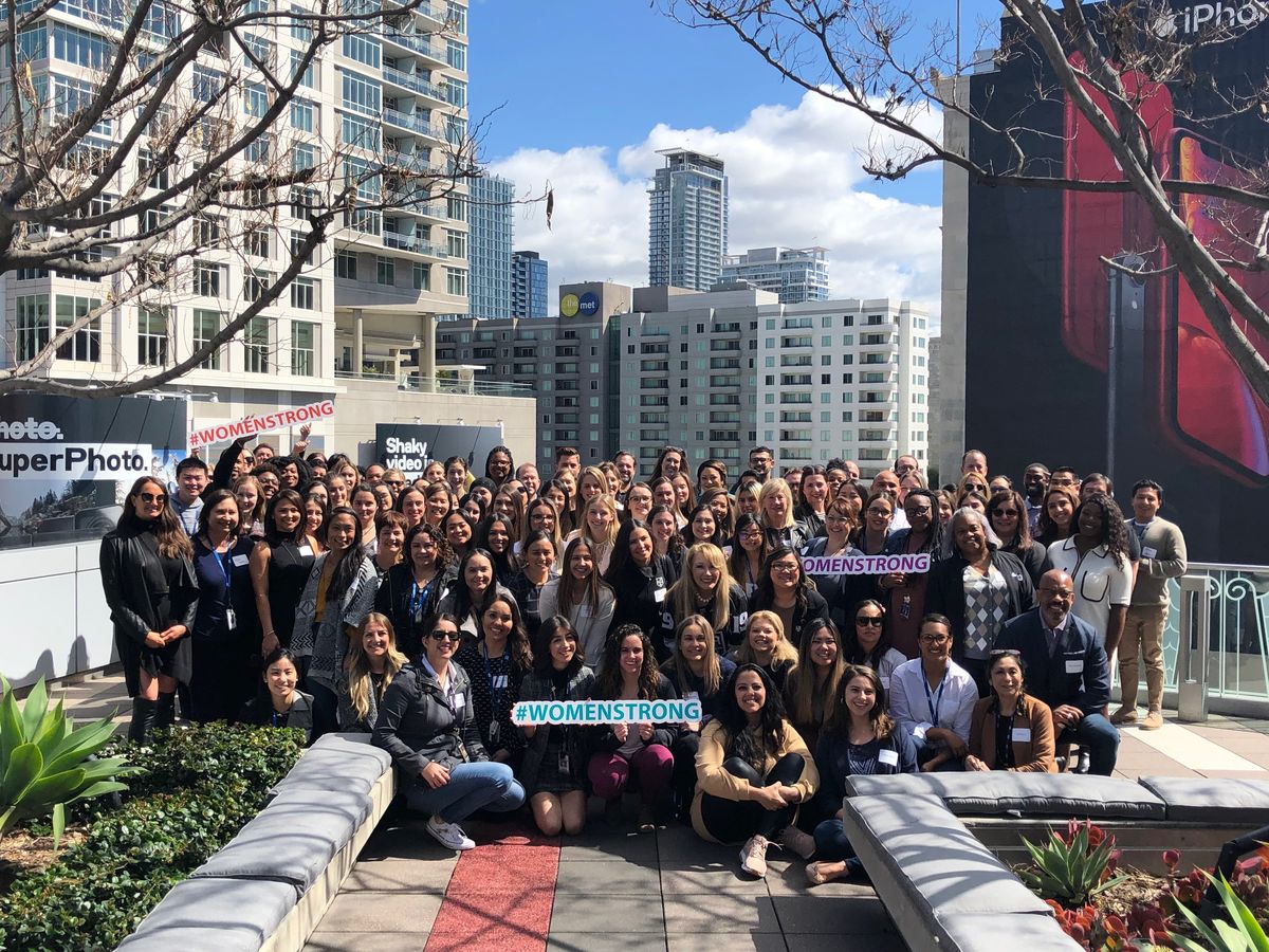 AEG employees gather for a group photo following an International Women's Day Event on the Terrace of The GRAMMY Museum. 