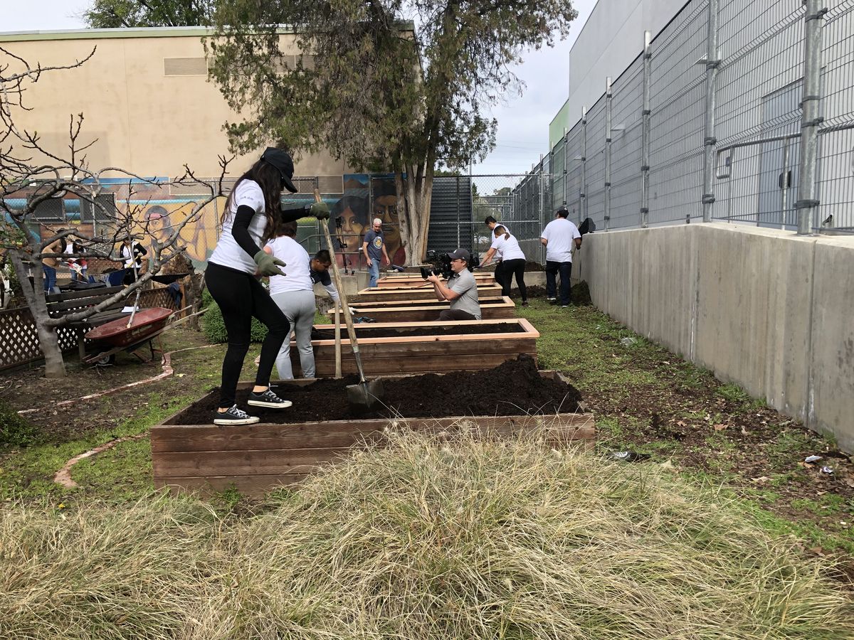 LA Kings employees install planter beds at Garvanza Elementary in Los Angeles.