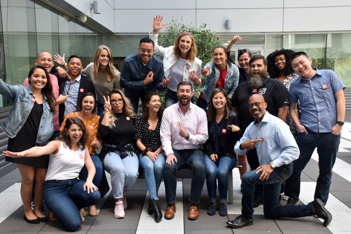 AEG employees wear denim and gather for a group photo for Denim Day, a campaign to raise awareness of sexual assault. 
