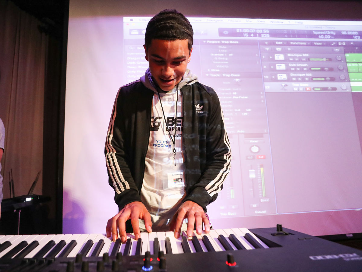 A student plays the keyboard during a music production class at the GRAMMY Museum as part of the BET Experience Youth Program presented by AEG.