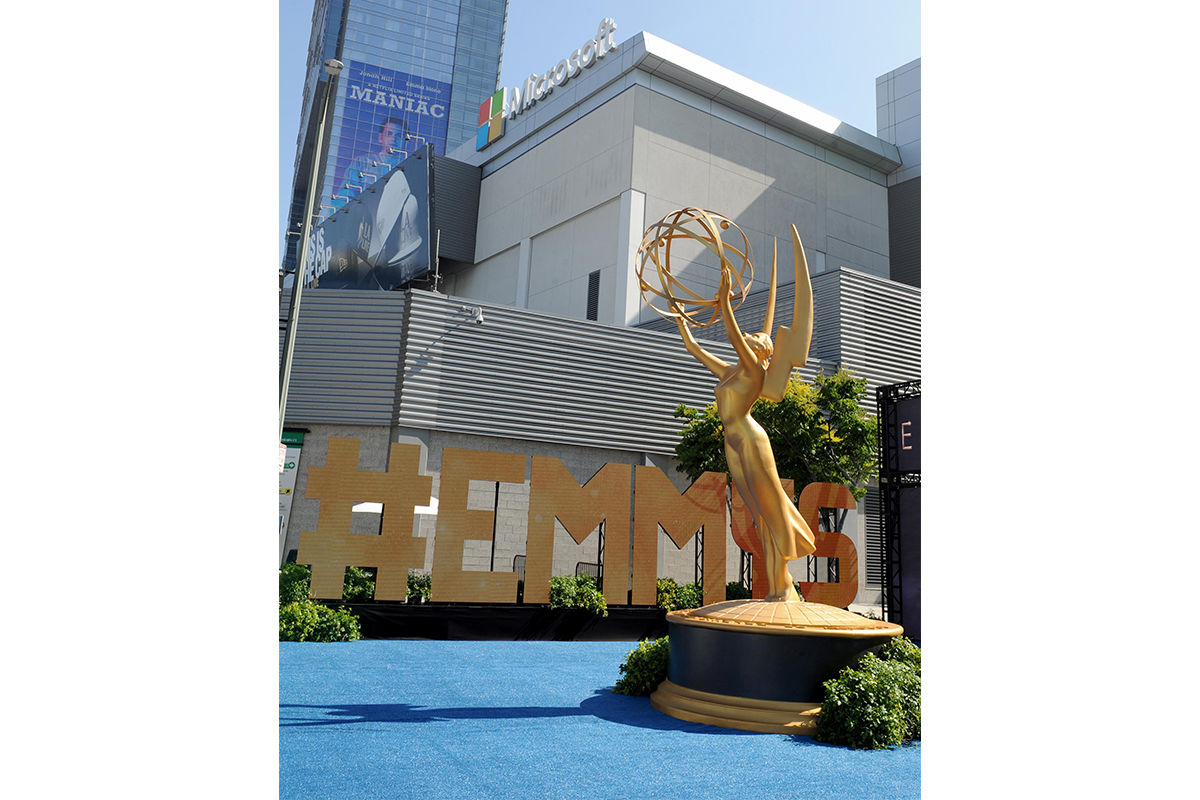 A life-size Emmy Award statue is set up in front of a #EMMYS sign for fans to take photos in front of at L.A. LIVE's Microsoft Square.