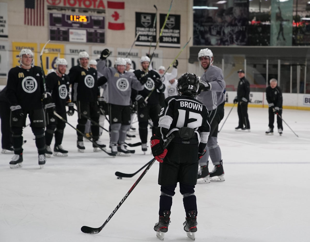 Twelve-year-old Jacob Brown skates out to the LA Kings team on the ice at Toyota Sports Park during a team practice as part of his Make-A-Wish to be a part of the team. 
