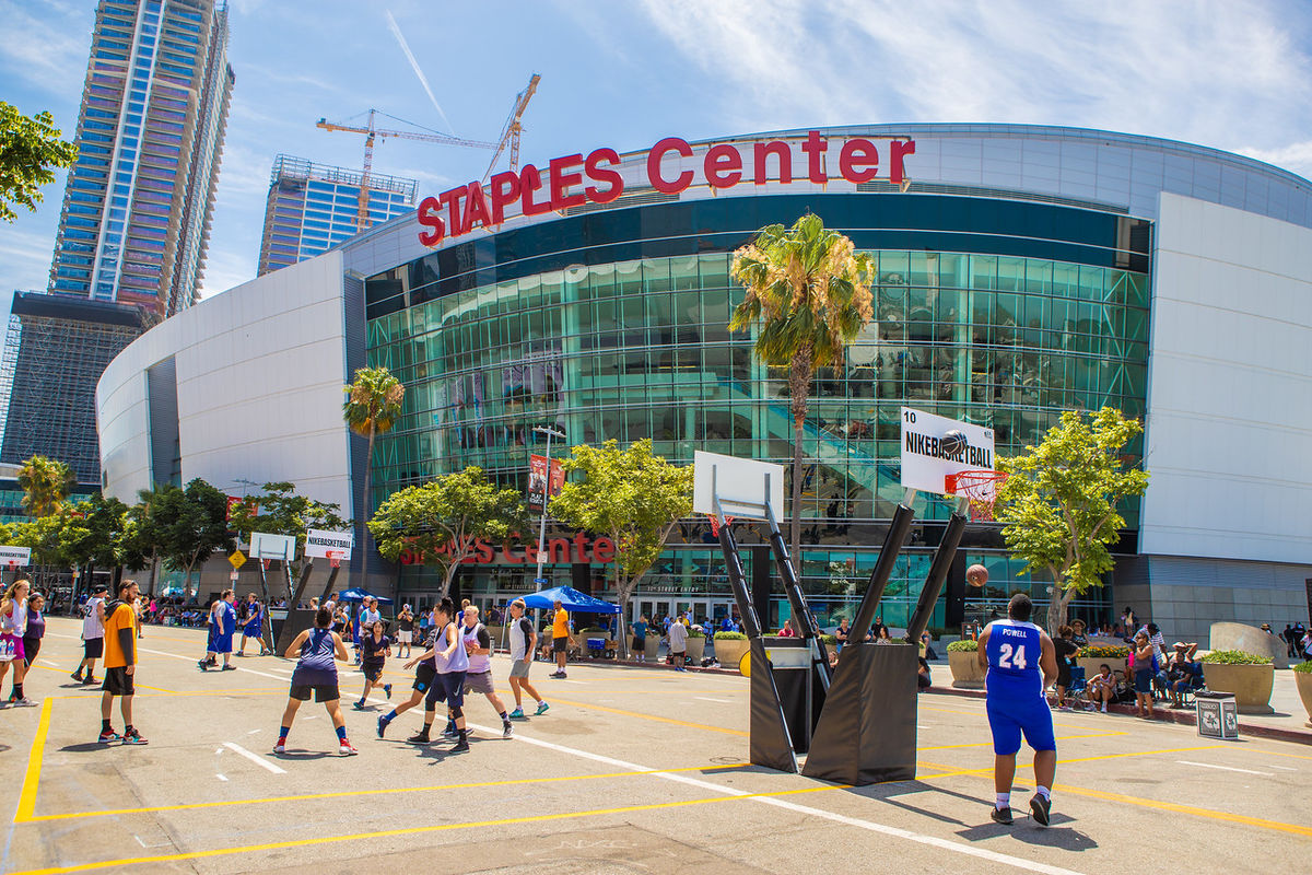 Basketball players play 3-on-3 games in the street in front of STAPLES Center. 