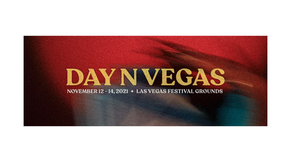 Day N Vegas appears in yellow text behind a blurred red background.