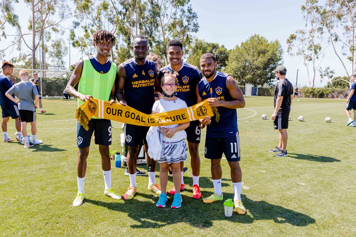 10-year-old Avery (center) meets with LA Galaxy players during practice at Dignity Health Sports Park during her Dream on 3 Sports Wish, in conjunction with MLS’s Kick Childhood Cancer Campaign on September 15, 2021.