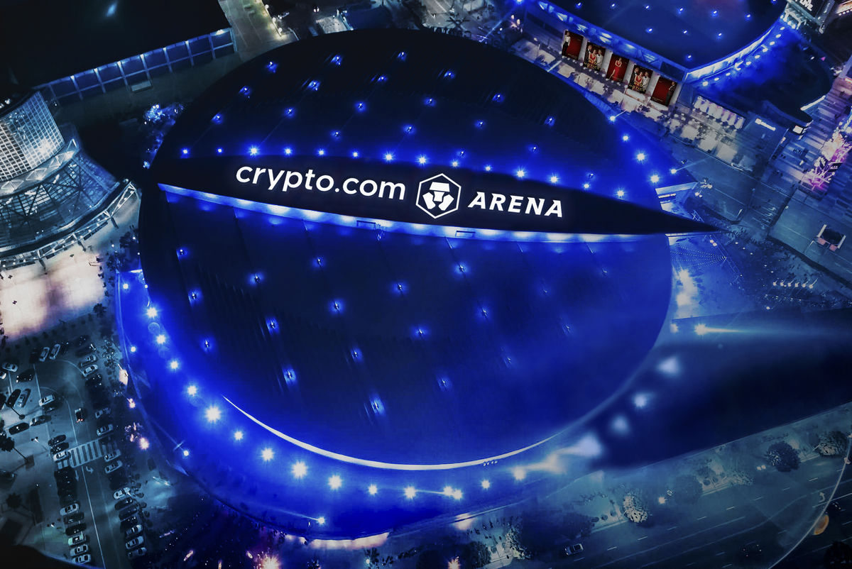 Aerial shot of crypto.com arena at night with blue lights.
