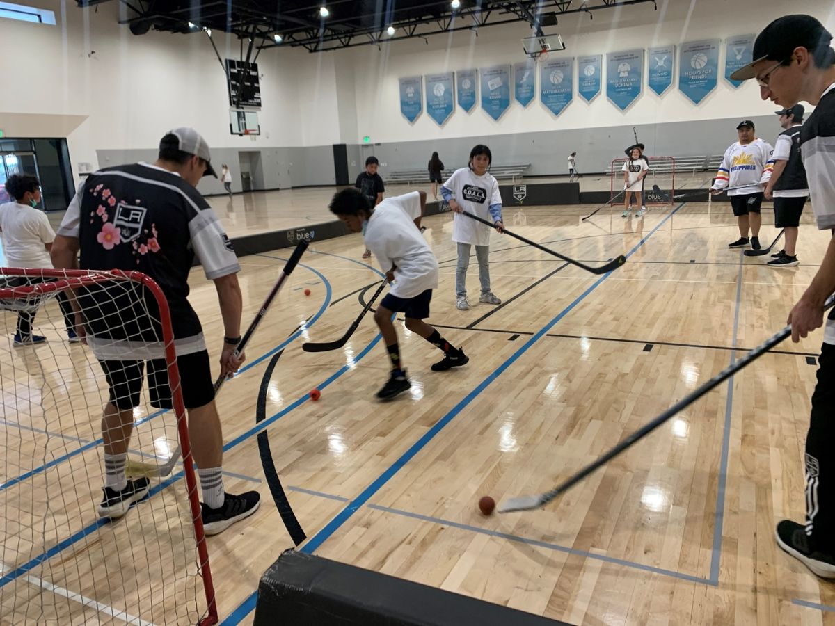  Five members from the LA Kings Hockey Development Staff and two members of the LA Kings Ice Crew introduce youth from the Little Tokyo Service Center Youth Club in Los Angeles the sport of ball hockey
