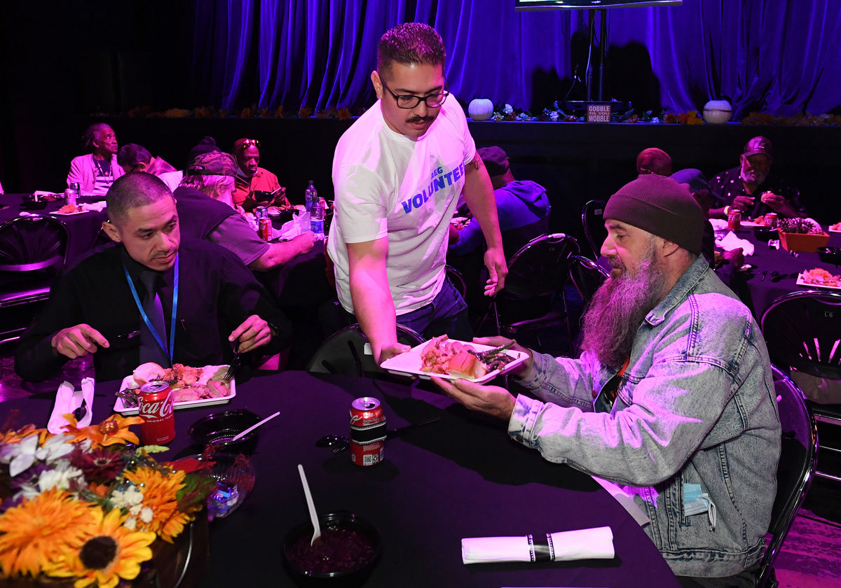 AEG employee volunteers serve Thanksgiving dinner to LA-based U.S. Vets and local families at The Novo.