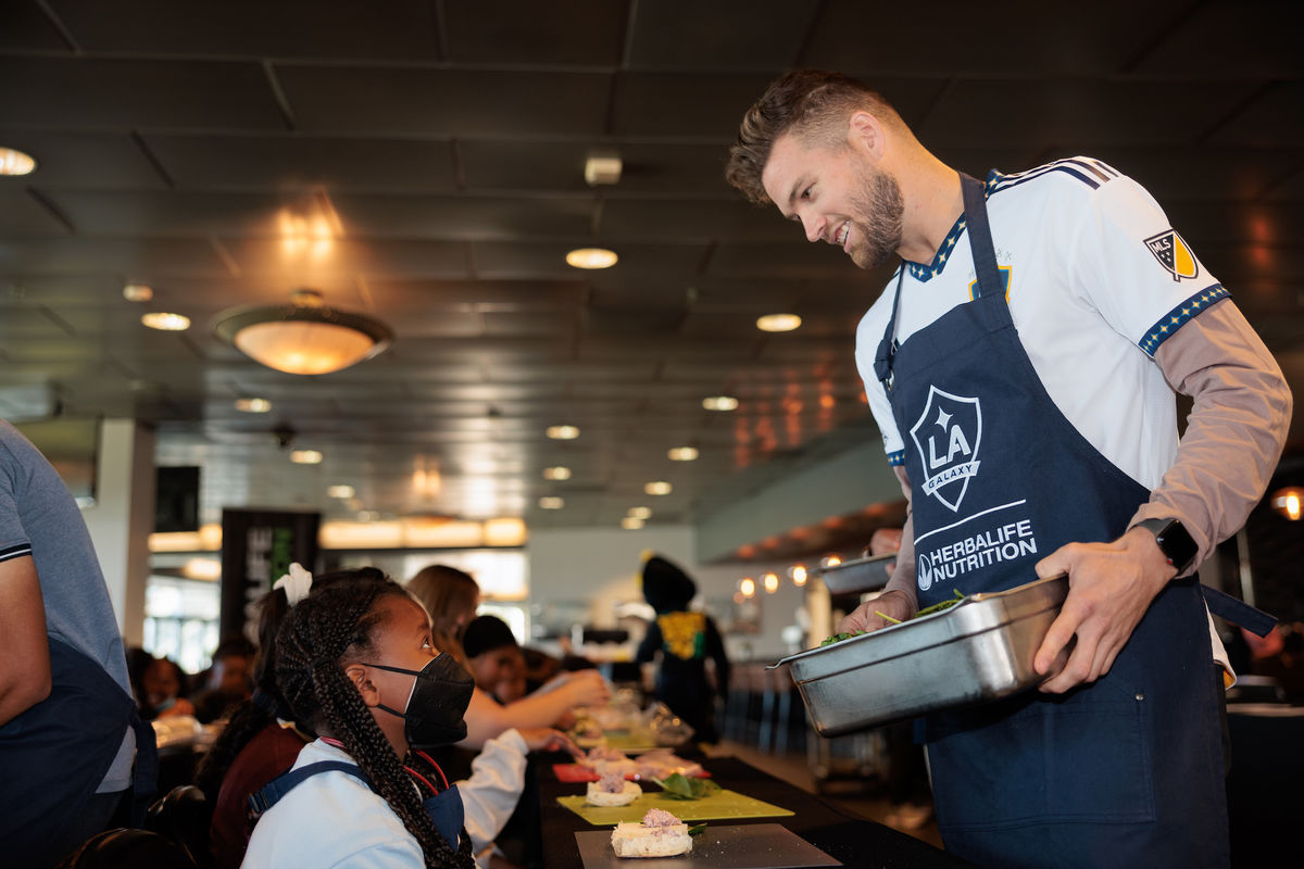 LA Galaxy player, Eriq Zavaleta, cooks with youth at Dignity Health Sports Park