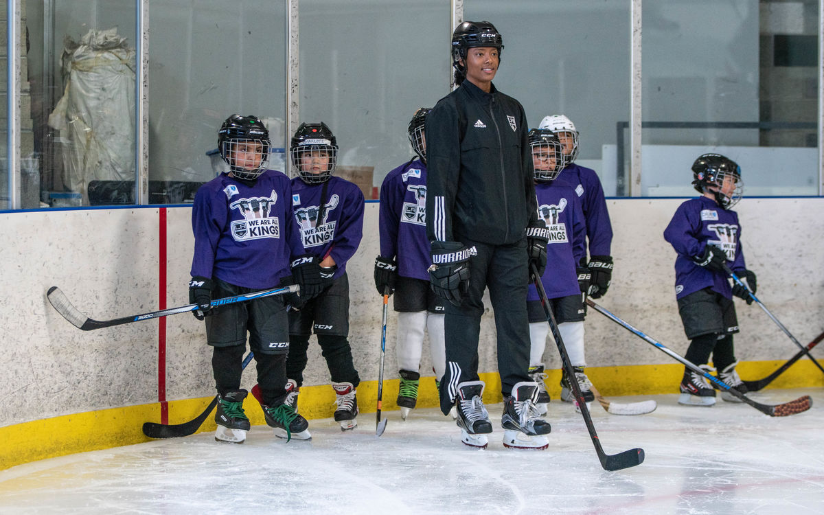 Participants at the LA Kings' We Are All Kings Camp receive instruction from Blake Bolden, AHL Scout and Growth and Inclusion Specialist for the LA Kings.