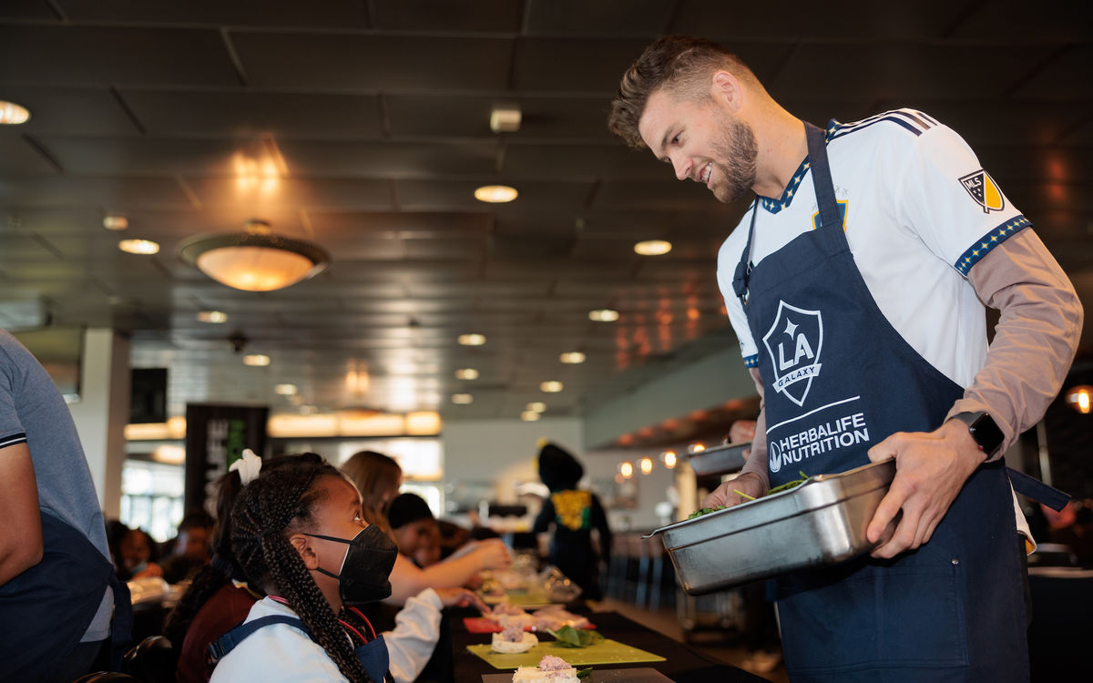 LA Galaxy player, Eriq Zavaleta, cooks with youth at Dignity Health Sports Park