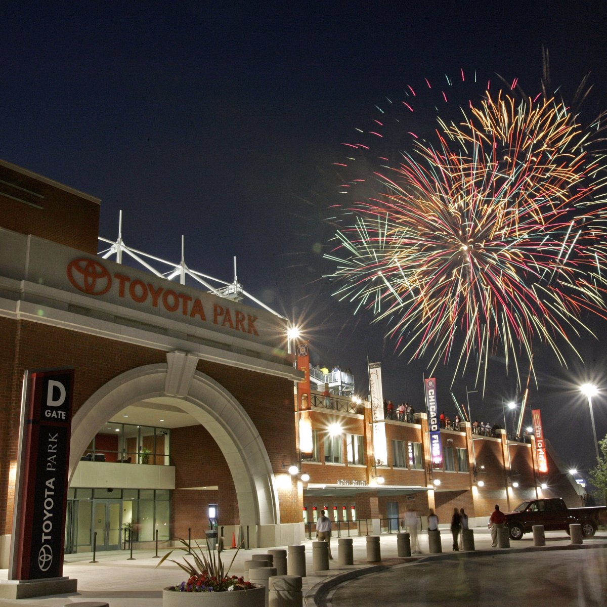 Exterior image of Toyota Park at night with fireworks behind it